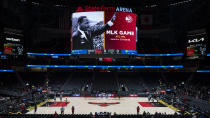Martin Luther King Jr. is displayed on a screen State Farm Arena before an NBA basketball game between the Atlanta Hawks and the Milwaukee Bucks, Monday, Jan. 17, 2022, in Atlanta. (AP Photo/Hakim Wright Sr.)