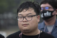 Activist Parit Chiwarak is seen ahead of a student rally at Thammasat University on Monday, Aug. 10, 2020 in Pathum Thani province, Thailand. The prominent protest leader was arrested Friday, Aug. 14, 2020 for involvement in a previous protest, even as student activists at Thailand's most prestigious university defied a ban by college administrators to stage an anti-government rally. (AP Photo/Sakchai Lalit)