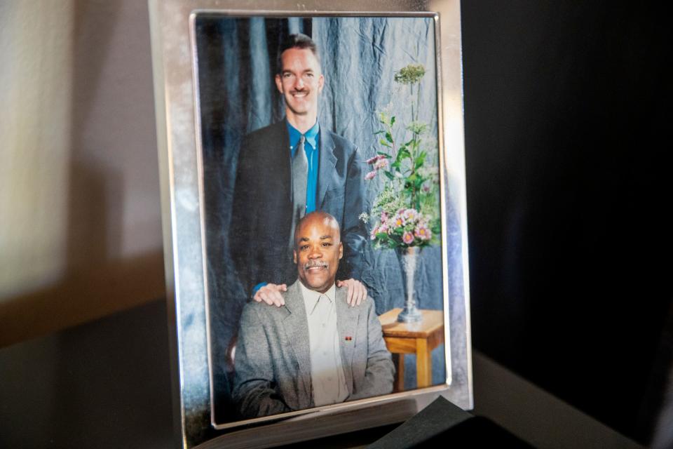 A photograph of long-time LGBTQ+ / AIDS activist Gilberto Gerald, sitting, and his husband Jeff Vessels is displayed inside their home in Cathedral City, Calif., on August 12, 2022. Gerald was interviewed for The Outwords Archive, the first and only national project to record, preserve, and share the stories of LGBTQ+ elders across the United States. 