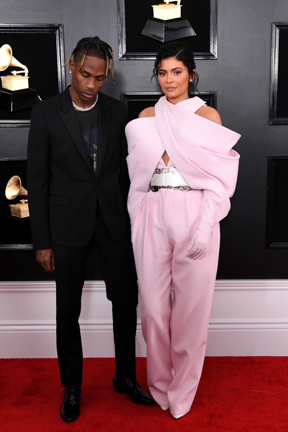 Travis Scott in Saint Laurent and Kylie Jenner in Balmain, Jimmy Choo shoes, and Lorraine Schwartz jewelry