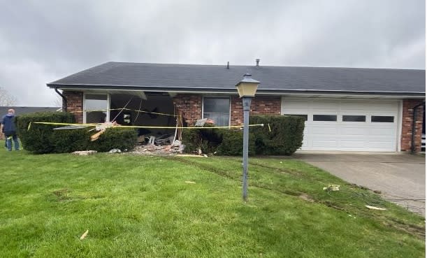 PHOTOS: Car crashes into Springfield living room