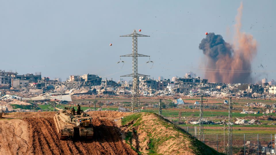 An Israeli tank takes position near the border with Gaza on January 16. - Menahem Kahana/AFP/Getty Images