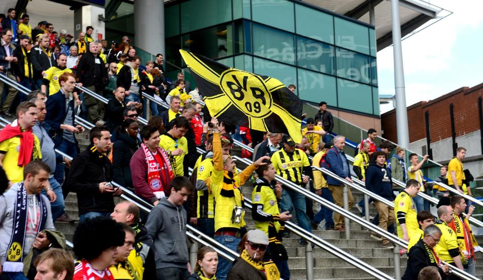 Borussia Dortmund fans make their way from Wembley Park Station near Wembley Stadium before the game.