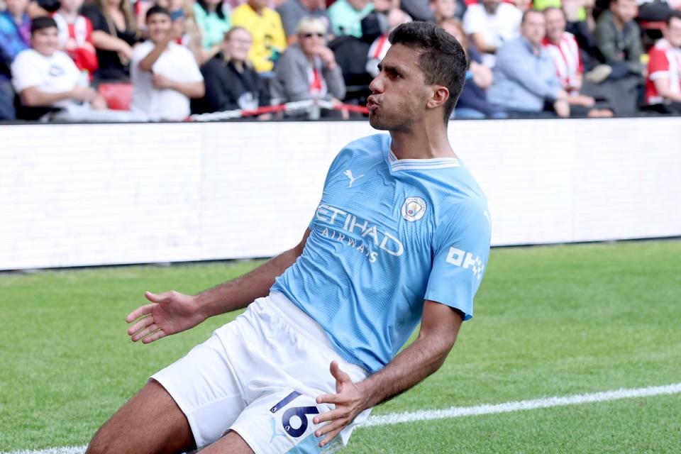 Match-winner: Rodri celebrates a dramatic late goal for Manchester City at Bramall Lane  (Getty Images)