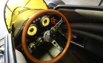 <p>Once you're in there, it's lovely with its yellow instrument dials and classic wood steering wheel.</p>