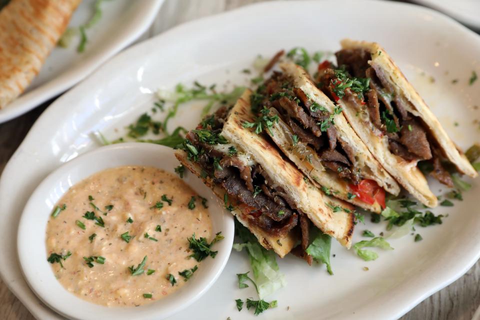 The Marcos, a Greek style quesadilla with gyro meat, kasseri cheese, sauteed peppers and onions; and served with spicy feta on the side, at Pappous Greek Kitchen in Yorktown Heights Oct. 26, 2023.