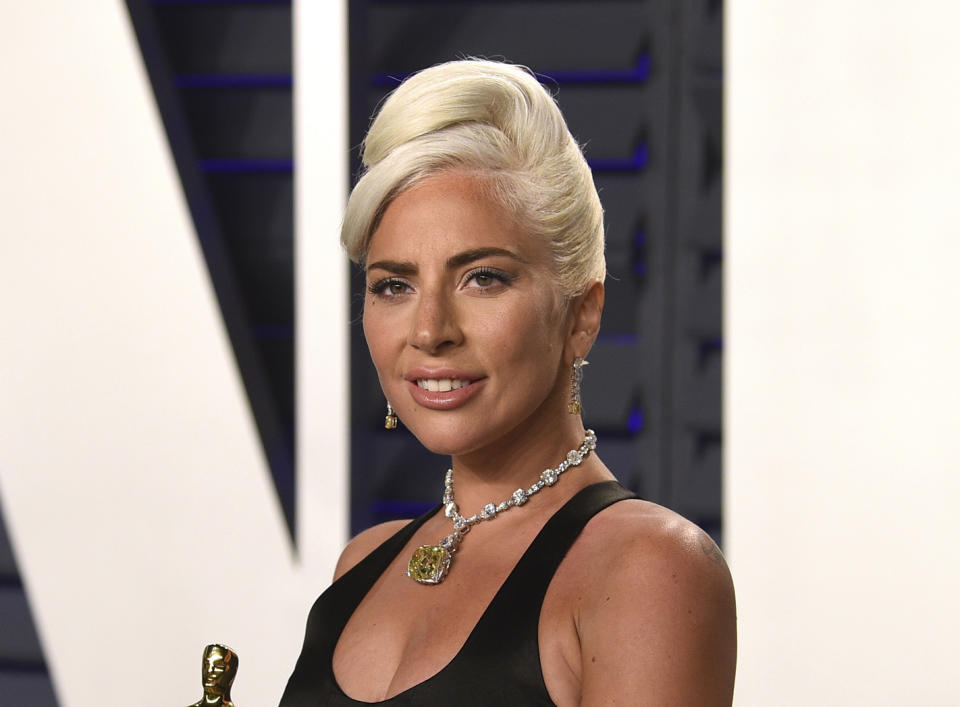 FILE - Lady Gaga, winner of the award for best original song "Shallow," arrives at the Vanity Fair Oscar Party on Sunday, Feb. 24, 2019, in Beverly Hills, Calif. The South Korean boy band BTS HAS won a leading four awards including best song for “Dynamite” and best group at the MTV Europe Music Awards Sunday, Nov. 8, 2020 while Lady Gaga took home the best artist prize.(Photo by Evan Agostini/Invision/AP, File)