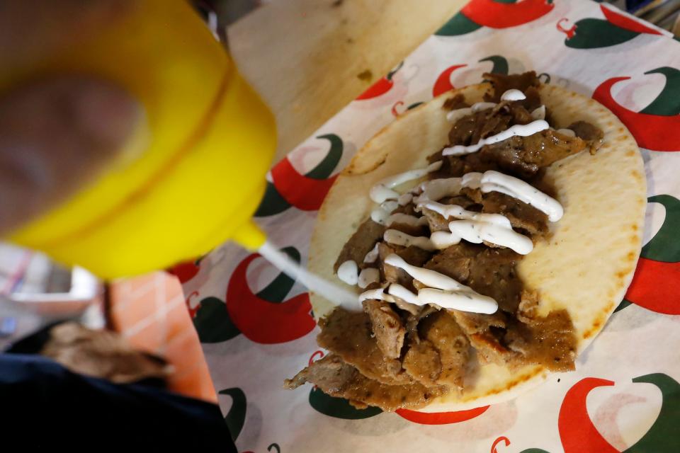 A gyro wrap is prepared at the Munch Hut in downtown Athens, Ga., on Wednesday, April 28, 2021. (Photo/Joshua L. Jones, Athens Banner-Herald) 