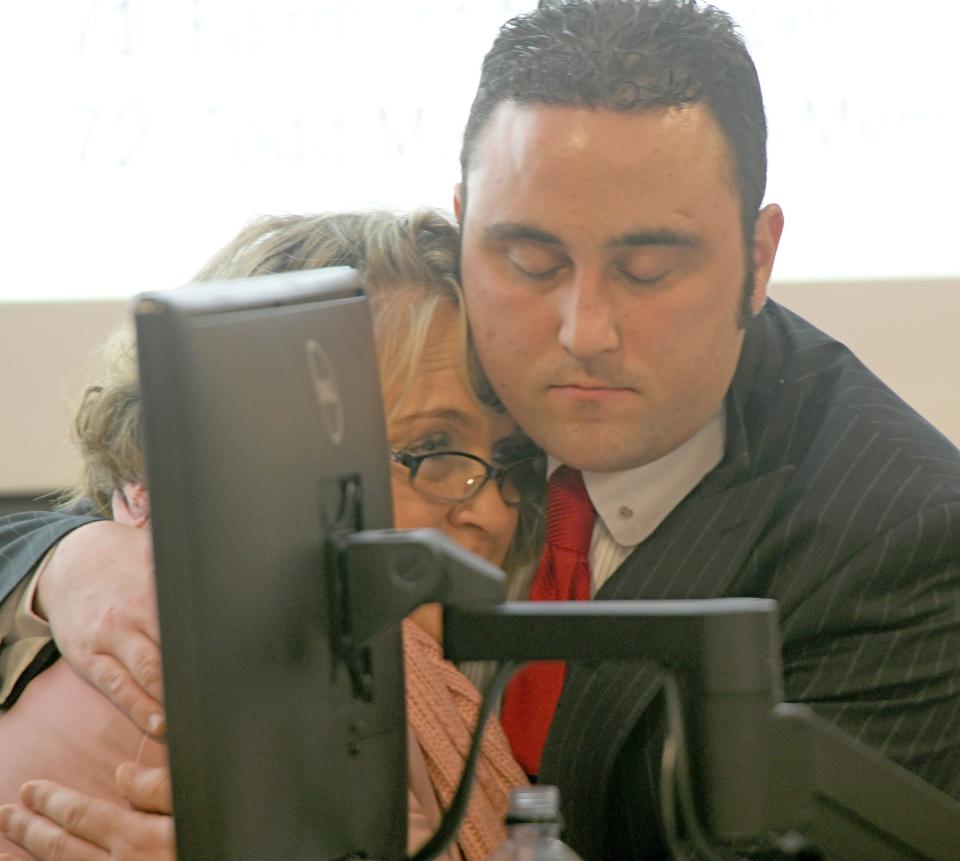 Shelby police detective Adam Turner shares a hug with Mindy Wilson, granddaughter of Mary Jane Croft Vangilder.