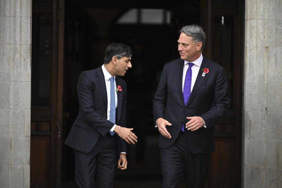 Britain's Prime Minister Rishi Sunak, left, greets Australia's Deputy Prime Minister and Minister of Defence Richard Marles on the second day of the UK Artificial Intelligence (AI) Safety Summit, at Bletchley Park, in Bletchley, England, Thursday, Nov. 2, 2023. U.S. Vice President Kamala Harris and British Prime Minister Rishi Sunak joined delegates Thursday at a U.K. summit focused on containing risks from rapid advances in cutting edge artificial intelligence. (Leon Neal/Pool Photo via AP)