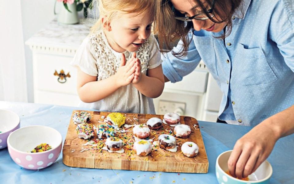 Children of all ages will love getting involved in the kitchen; try making fairy cakes or biscuits - Alamy Images 