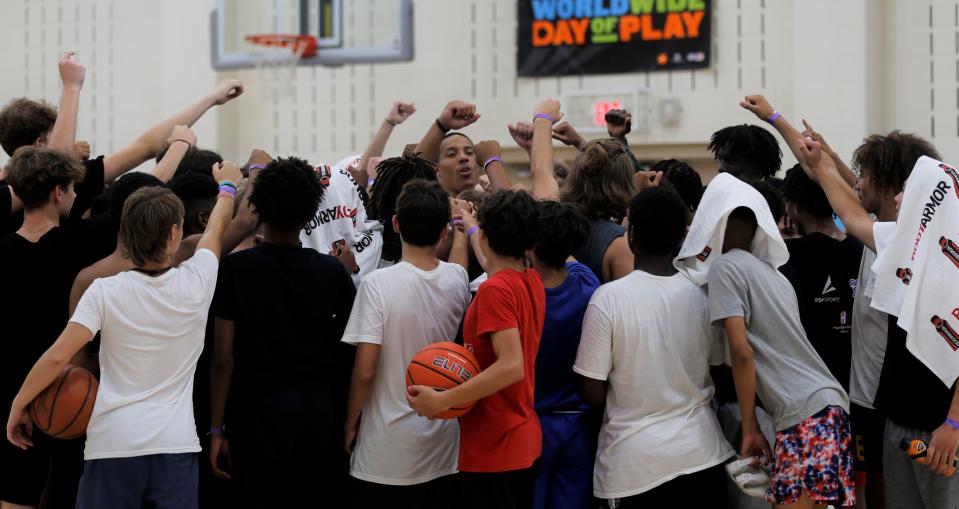 Desmond Bane breaks down the final huddle at his basketball camp July 18, 2022.
