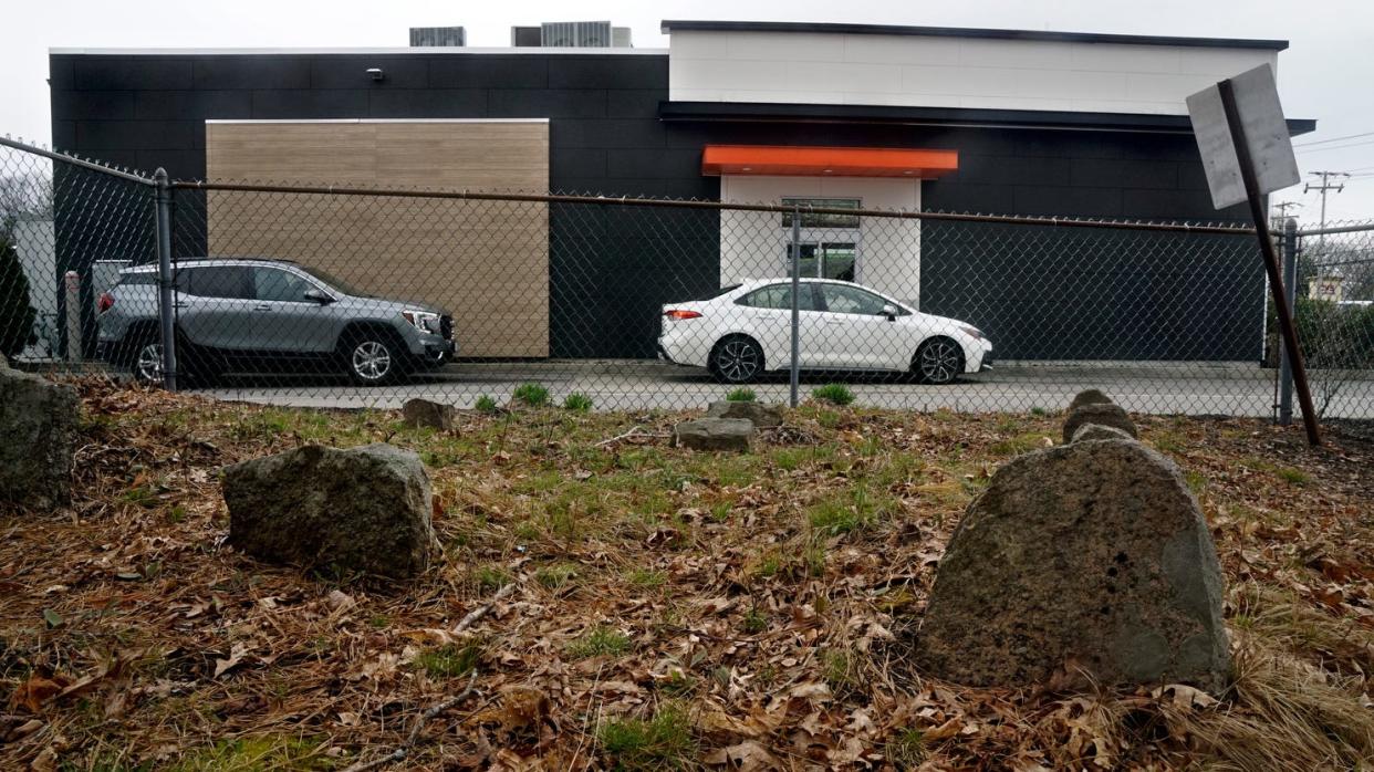 RI historical cemetery 78 in Coventry, between a Scrub-a-dub car wash and a Dunkin' drive-thru window.