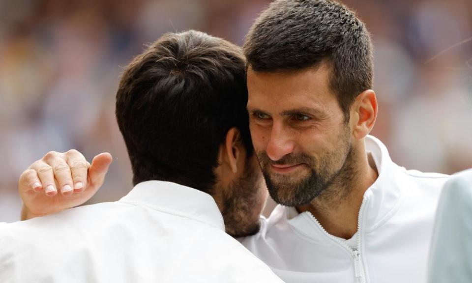 Novak Djokovic congratulates Carlos Alcaraz during the awards ceremony