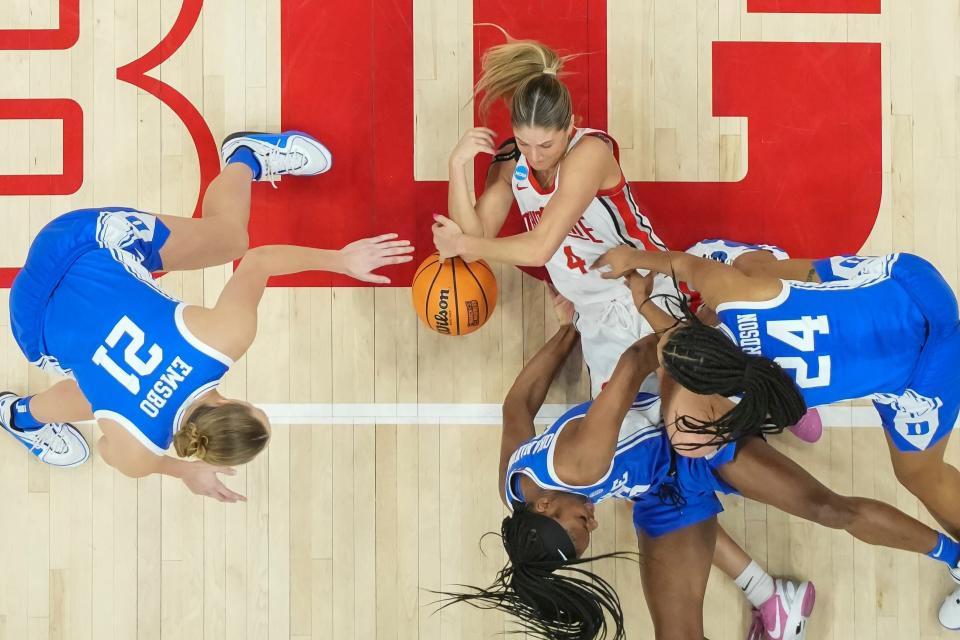 Ohio State guard Jacy Sheldon scrambles for a loose ball with Duke's Reigan Richardson (24), Oluchi Okananwa (5) and Camilla Emsbo (21).