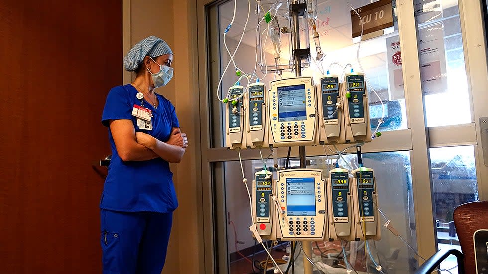 Nursing coordinator Beth Springer looks into a patient's room in a COVID-19 ward at the Willis-Knighton Medical Center in Shreveport, La. on Tuesday, August 17, 2021.