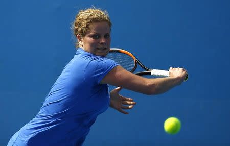 Belgium's Kim Clijsters hits a shot during a practice session at Melbourne Park, Australia, January 17, 2016. REUTERS/Thomas Peter