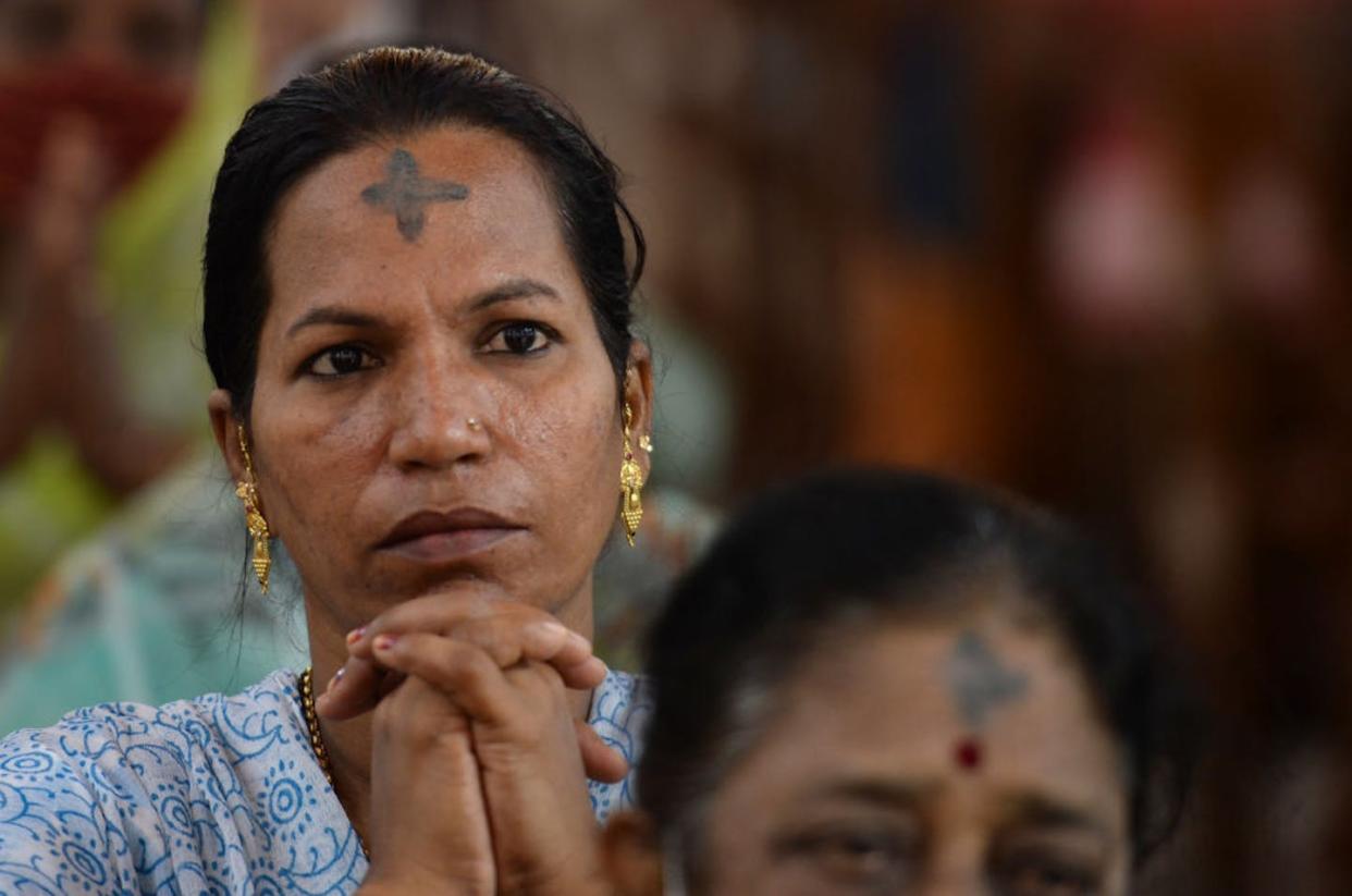 A Catholic Ash Wednesday service at St. Thomas Cathedral Basilica in Chennai, India, in 2022. <a href="https://www.gettyimages.com/detail/news-photo/catholic-christian-devotees-attend-a-holy-mass-during-an-news-photo/1238867563?phrase=ash%20wednesday&adppopup=true" rel="nofollow noopener" target="_blank" data-ylk="slk:Arun Sankar/AFP via Getty Images;elm:context_link;itc:0;sec:content-canvas" class="link ">Arun Sankar/AFP via Getty Images</a>