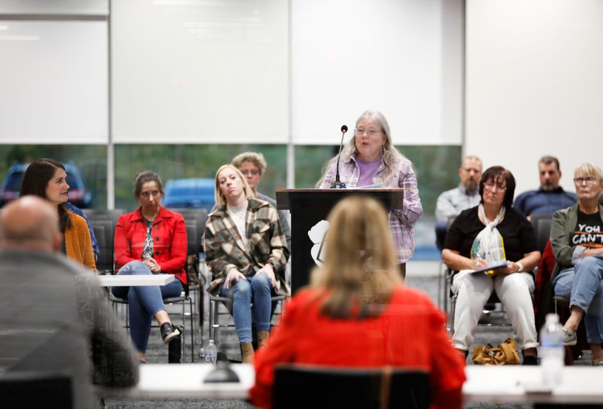 The Ozark school board takes questions Tuesday during a town hall meeting. The district plans three more town hall meetings this school year.