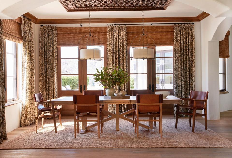 hollywood stunt man, tammy randall wood's spanish colonial home in the santa monica mountains designed by interior archaeology dining room a patterned zimmer rohde curtain fabric plays into the more formal side of the spanish colonial ceiling accent antique panel roman shades hunter douglas pendants currey company table custom, interior archeology chairs noble souls