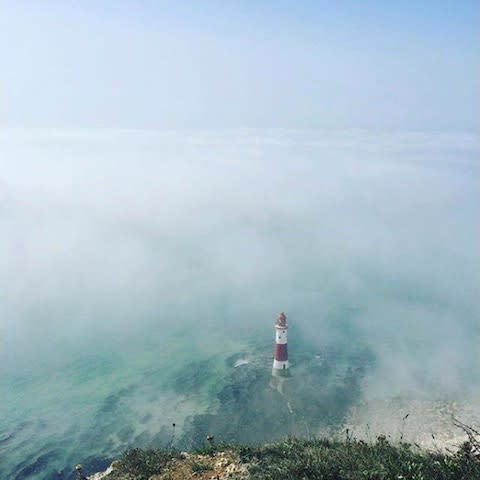 Beachy Head Lighhouse is surrounded by mist near Eastbourne,  - Credit: Reuters