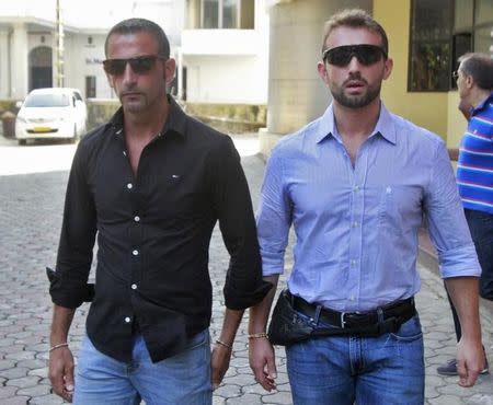 Italian sailors Salvatore Girone (R) and Massimiliano Latorre leave the police commissioner office in the southern Indian city of Kochi January 18, 2013. REUTERS/Sivaram V