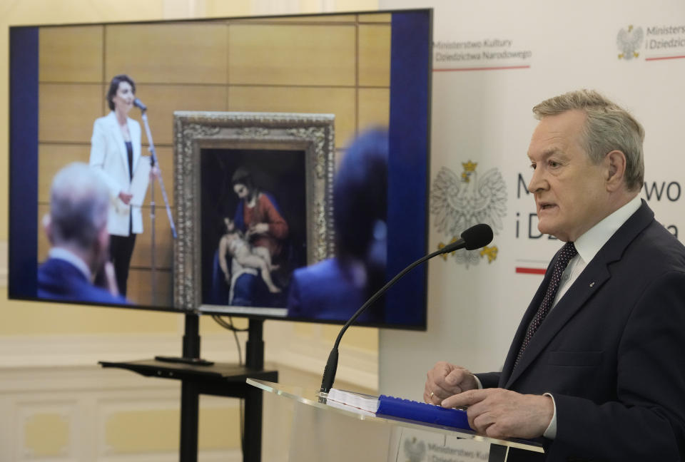 Poland's culture minister, Piotr Glinski, right, adresses the media during a press conference in Warsaw, Poland, Wednesday, May 31, 2023. Glinski said that a precious 16th century painting "Madonna with Child," attributed to Alessandro Turchi, that was looted from a private Polish collection by Nazi Germany during World War II has been found in Japan and returned to Poland's ownership. (AP Photo/Czarek Sokolowski)