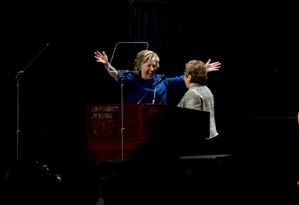 Former secretary of state Hillary Clinton, left, greets University of Miami President Donna Shalala before she spoke to a group of supporters and University of Miami students in Coral Gables, Fla., Wednesday, Feb. 26, 2014. (AP Photo/J Pat Carter)