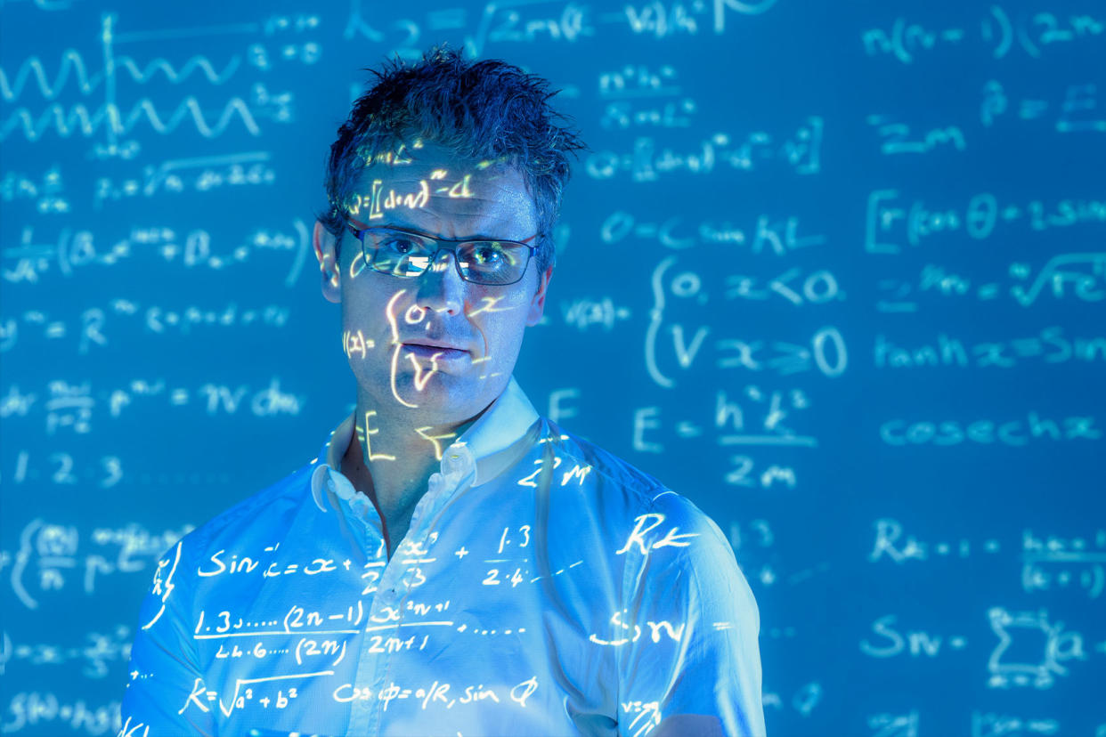 Scientist with math equations data projected Getty Images/Monty Rakusen