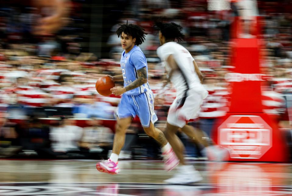 Jan 10, 2024; Raleigh, North Carolina, USA; North Carolina Tar Heels guard Elliot Cadeau (2) dribbles with the ball during the first half against North Carolina State Wolfpack at PNC Arena. Mandatory Credit: Jaylynn Nash-USA TODAY Sports