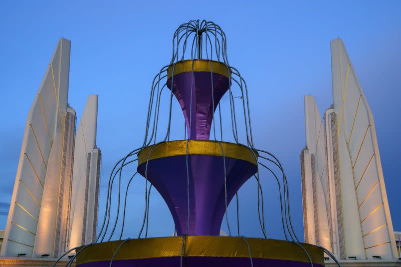 A decorative fountain is pictured in front of the Democracy monument in Bangkok