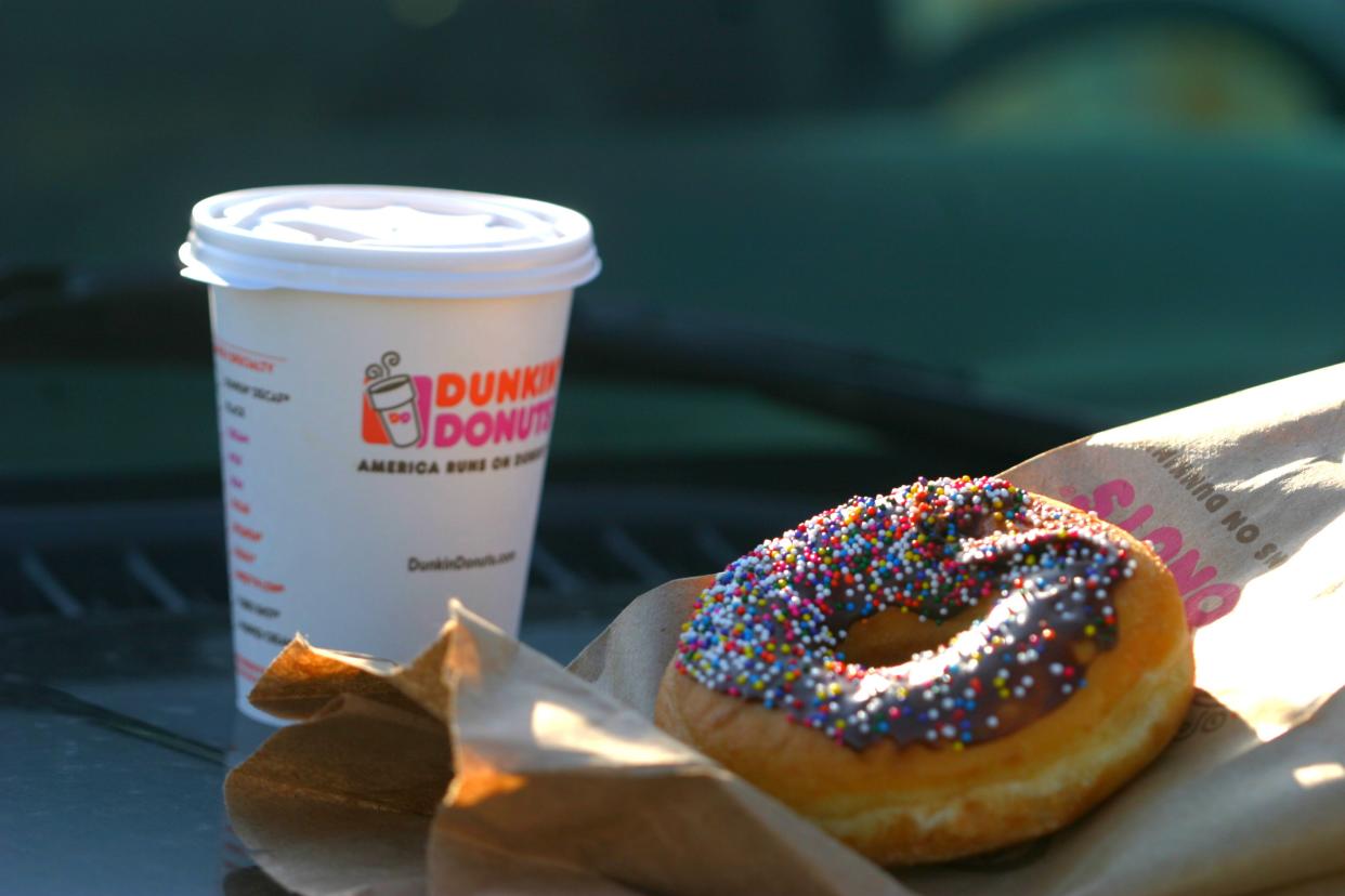 Brooklyn, New York, USA - April 12, 2014: A Dunkin Donuts coffee and doughnut.