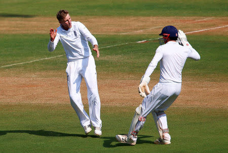 Cricket - India v England - Fourth Test cricket match - Wankhede Stadium, Mumbai, India - 10/12/16. England's Joe Root (L) celebrates the wicket of India's Ravichandran Ashwin. REUTERS/Danish Siddiqui
