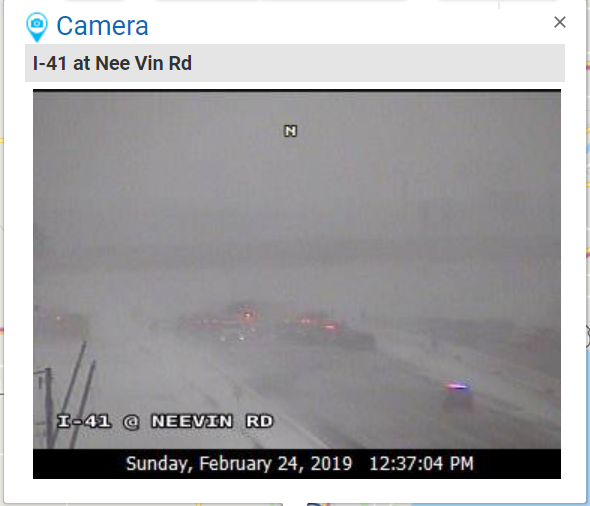 A Wisconsin Department of Transportation highway camera shows emergency vehicles on Interstate 41 southbound near Neenah. Unconfirmed scanner traffic indicates  about 40 cars were involved in a pileup.