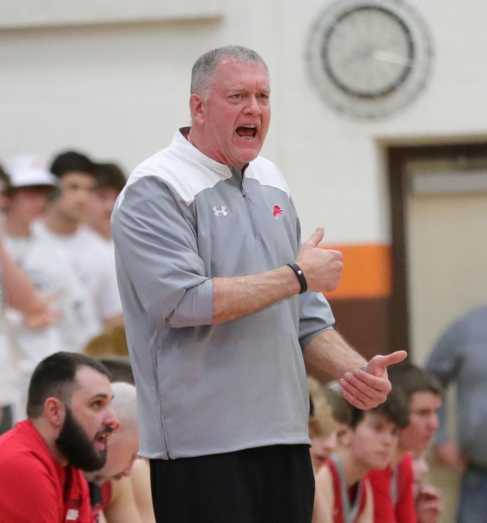 Minerva boys basketball head coach Rich Hart encourages his team during a district semifinal against Maysville, Wednesday, March 6, 2024, at Claymont High School.