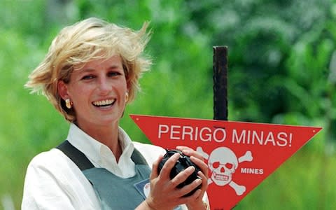 Princess Diana during a visit to Angola, just months before her death - Credit: Reuters