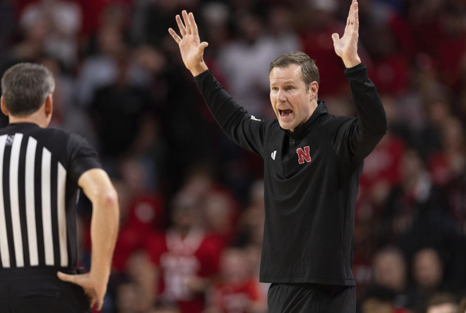 Nebraska head coach Fred Hoiberg, right, argues with the referee about a foul called against his team while playing against Wisconsin during the first half of an NCAA college basketball game Thursday, Feb. 1, 2024, in Lincoln, Neb. (AP Photo/Rebecca S. Gratz)