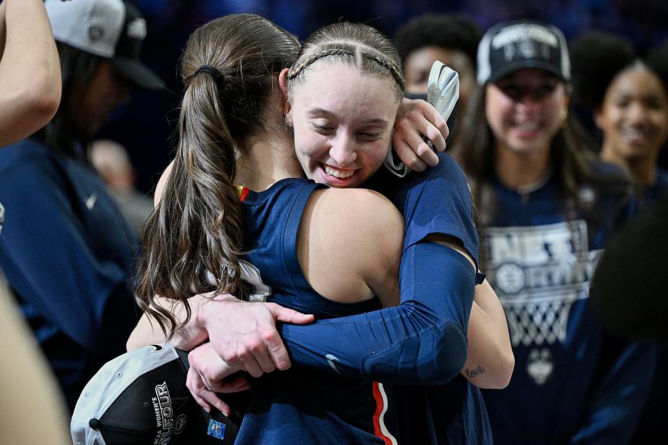 UConn's Paige Bueckers celebrates with Nika Muhl after beating USC on Monday night.