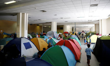 Tents are set inside the disused Hellenikon airport, where refugees and migrants are temporarily housed, in Athens, Greece, July 13, 2016. REUTERS/Alkis Konstantinidis/File Photo