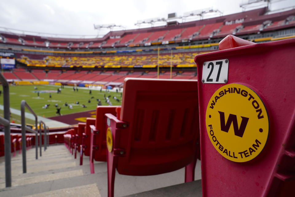 Seats at Fedex Field display the Washington Football Team logo on the seats during pregame warmups of an NFL football game between Washington Football Team and Philadelphia Eagles, Sunday, Sept. 13, 2020, in Landover, Md. (AP Photo/Susan Walsh)