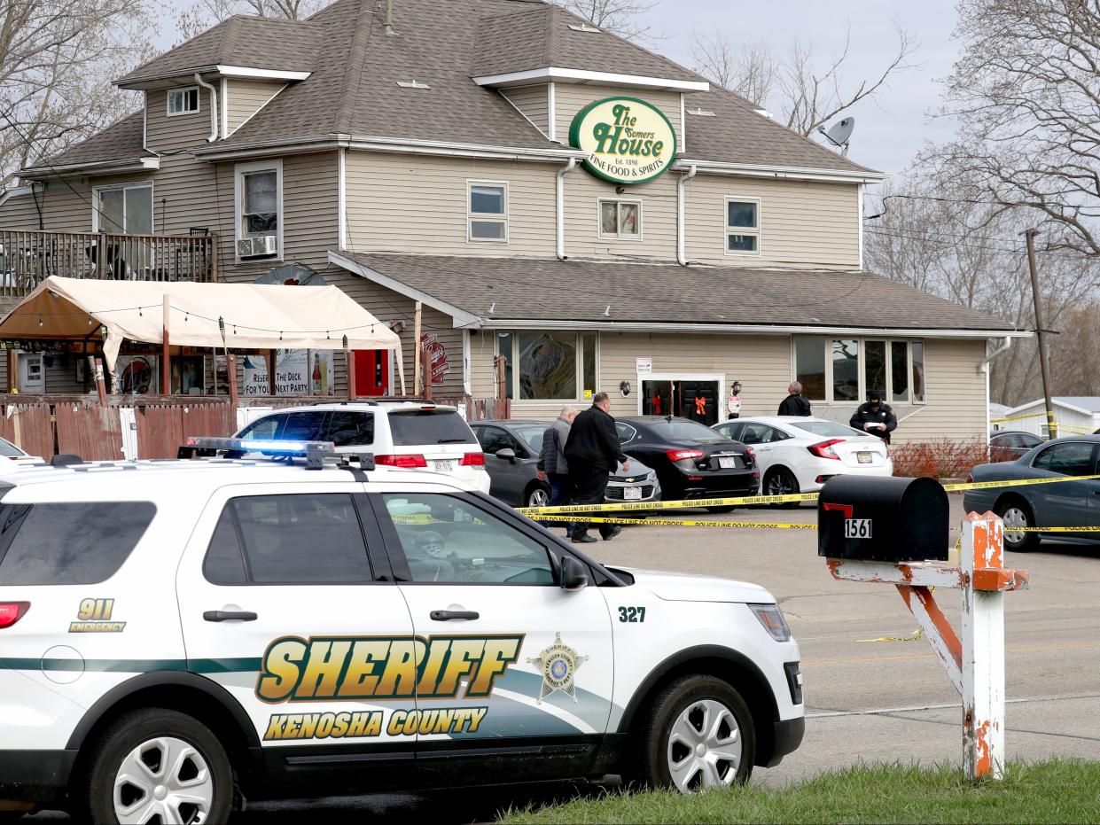 <p>Officials investigate the scene a deadly shooting at Somers House Tavern in Kenosha, Wisconsin on Sunday, 18 April, 2021</p> (AP)