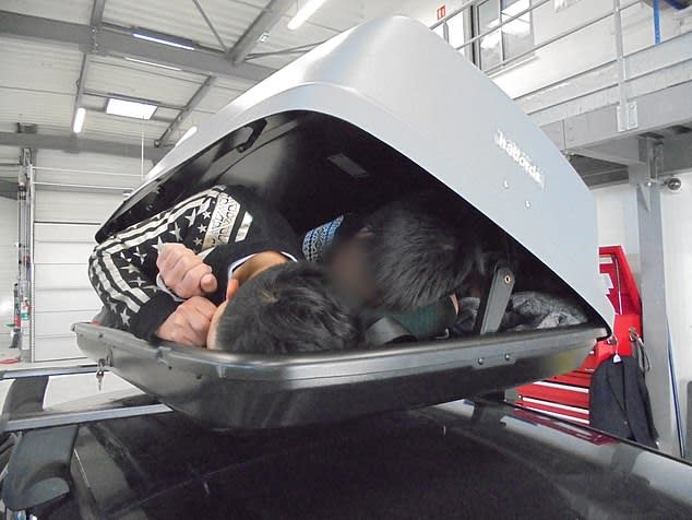 Three Vietnamese migrants were crammed into the car roof box (Picture: Home Office)