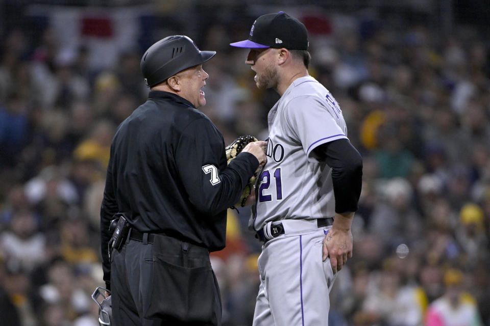 Colorado Rockies starting pitcher Kyle Freeland, right, exhanges words with home plate umpire Brian O'Nora during the second inning of a baseball game against the San Diego Padres in San Diego, Friday, March 31, 2023. (AP Photo/Alex Gallardo)