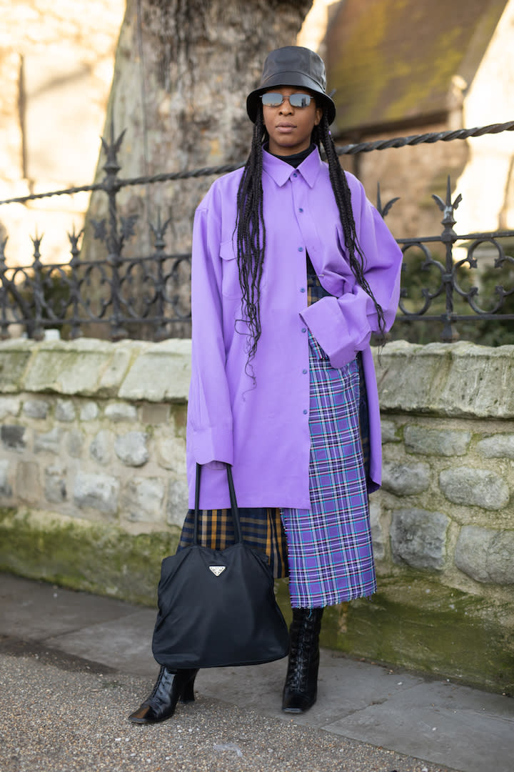 <p>A guest spotted out and about in London wearing an oversized shirt, matching bucket hat and Prada bag. <em>[Photo: Getty]</em> </p>