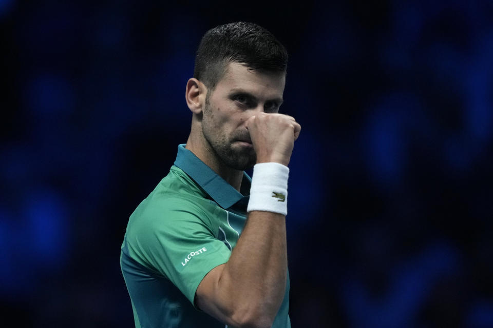 Serbia's Novak Djokovic reacts during the singles tennis match against Denmark's Holger Rune, of the ATP World Tour Finals at the Pala Alpitour, in Turin, Italy, Sunday, Nov. 12, 2023. (AP Photo/Antonio Calanni)