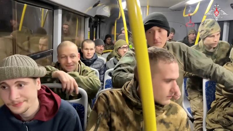 A still image from video, released by the Russian Defence Ministry, shows what it said to be captured Russian service personnel in a bus following the latest exchange of prisoners of war