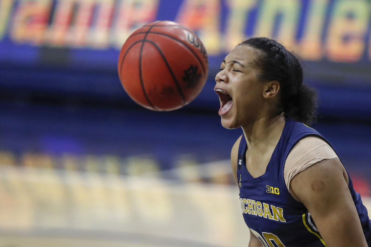 Michigan Wolverines forward Naz Hillmon (00) reacts after scoring against the Notre Dame Fighting Irish during the first half of an NCAA basketball game on Thursday, Dec. 3, 2020, in Notre Dame, Ind. (AP Photo/Kamil Krzaczynski)