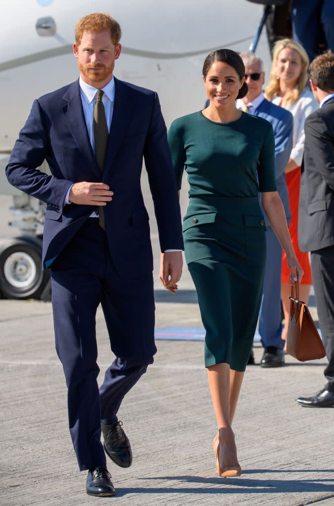 <p>The royals have arrived in Dublin! <a href="https://www.townandcountrymag.com/style/fashion-trends/a22104648/meghan-markle-green-outfit-dublin-royal-visit-2018/" rel="nofollow noopener" target="_blank" data-ylk="slk:Meghan wore an appropriately green ensemble by Givenchy;elm:context_link;itc:0;sec:content-canvas" class="link ">Meghan wore an appropriately green ensemble by Givenchy</a> with a Strathberry Midi Tote and sleek low bun for her trip to Ireland, where she and Harry are on a royal visit. </p>