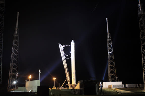 A SpaceX Falcon 9 rocket stands topped with an unmanned Dragon space capsule - the first commercial spacecraft ever to launch to the International Space Station - on May 17, 2012. The rocket and Dragon are due to launch on May 19, 2012 from Cap