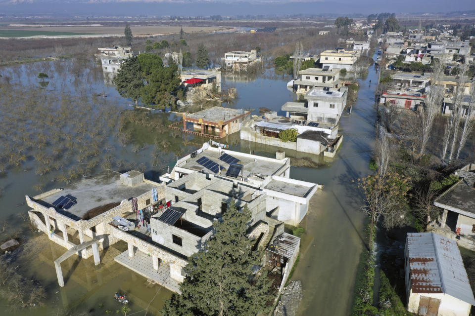 An aerial view of the al-Tlul village flooded after a devastating earthquake destroyed a river dam in the town of Salqeen near the Turkish border, Idlib province, Syria, Thursday, Feb. 9, 2023. (AP Photo/Ghaith Alsayed)